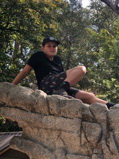 Boy Wearing Black Shirt — Whittier, CA — Trinity Realty & Trinity Home Loans Inc.