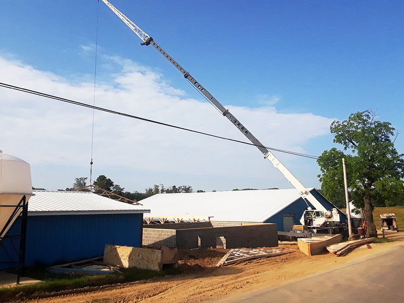 A large crane is being used to lift a building