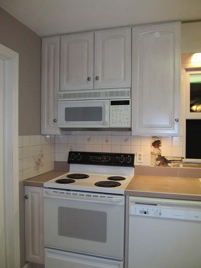 Stove with Overhead Cabinet — The Tri-State Area — Carriage House II In-Home Restorations