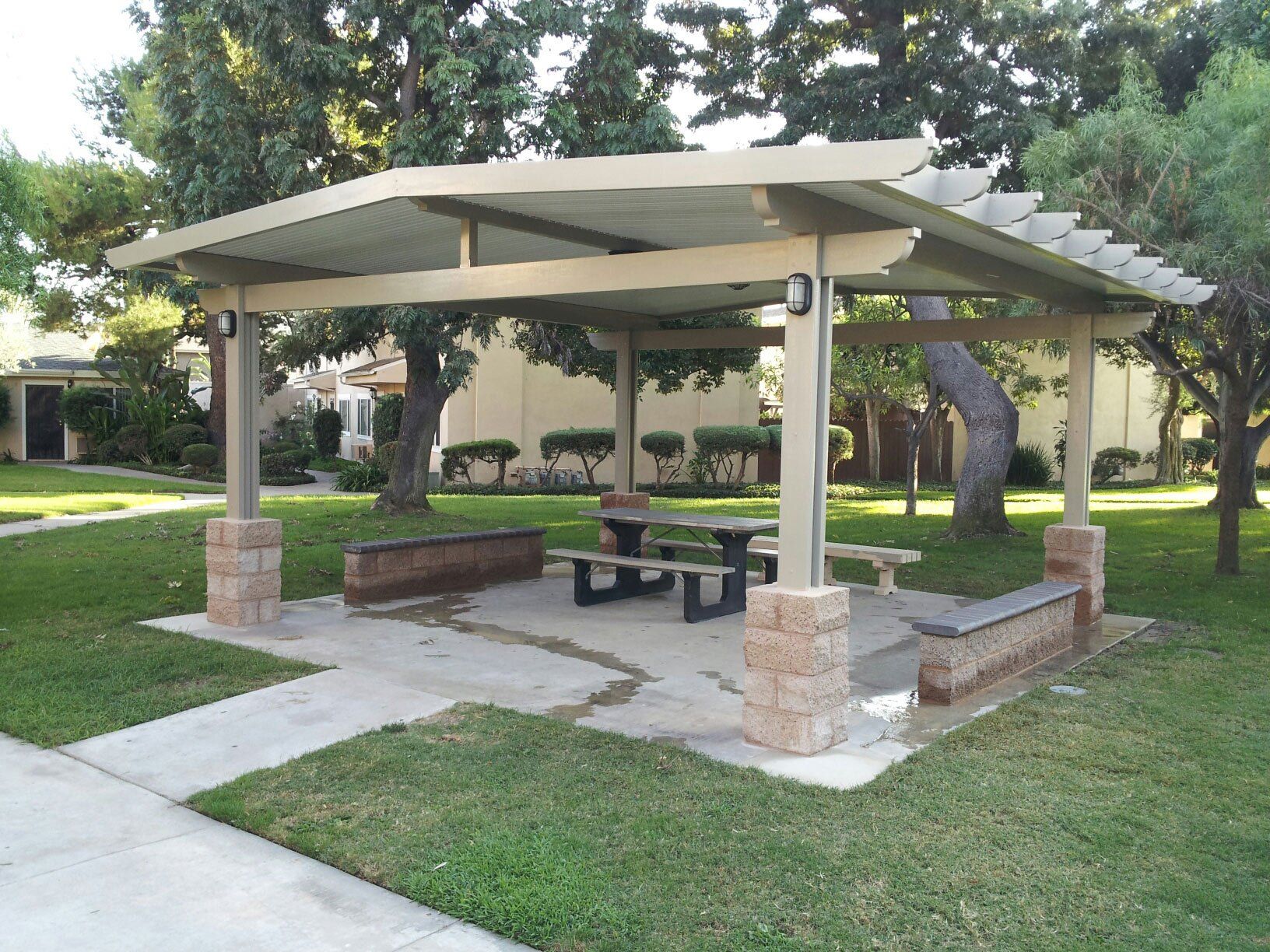 View of a covered seating arrangement in a garden
