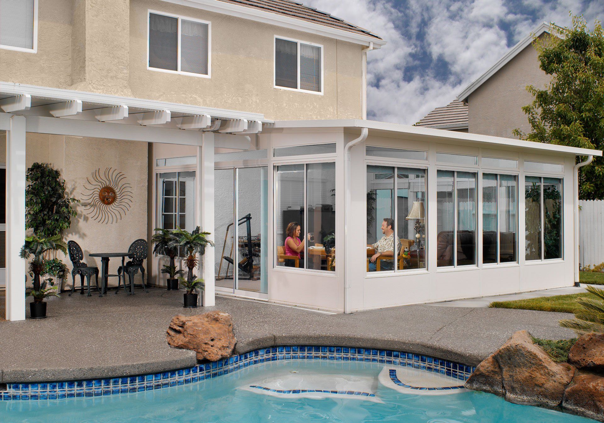 Backyard sunroom with pool