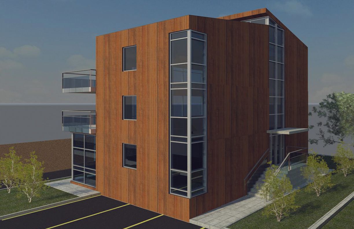 A modern, three-story building with wood-paneled walls, large glass windows, and balconies, set in a grassy landscape.