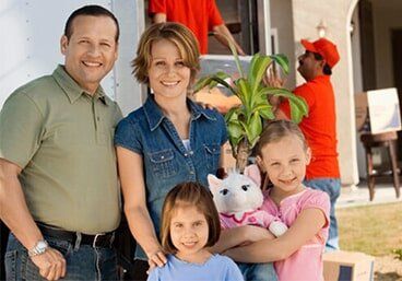 Family with New Home — Moving Company in Altoona, PA Family with New Home — Moving Company in Altoona, PA