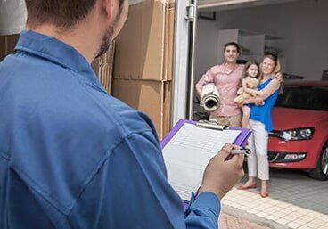 Mover holding clipboard and invoice — Residential Movers in Altoona, PA Mover holding clipboard and invoice — Residential Movers in Altoona, PA