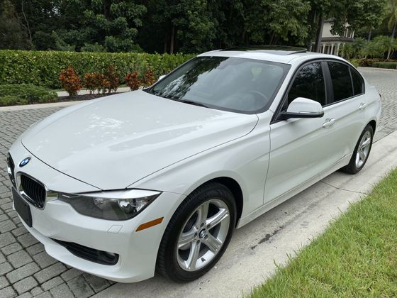 Parked White BMW - Quarry Motors in Naples, FL