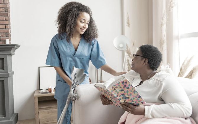 Carer with older woman at home