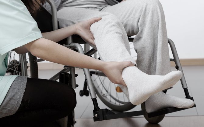 Assisting person in wheelchair