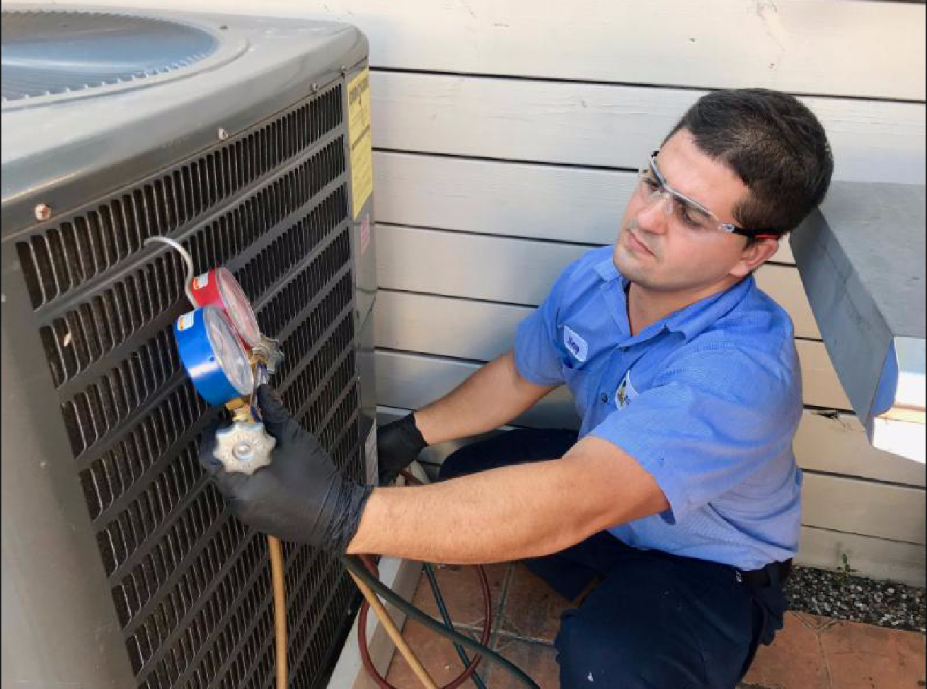 Technician checking air unit