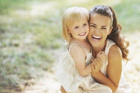 Woman holding a child Woman holding a child