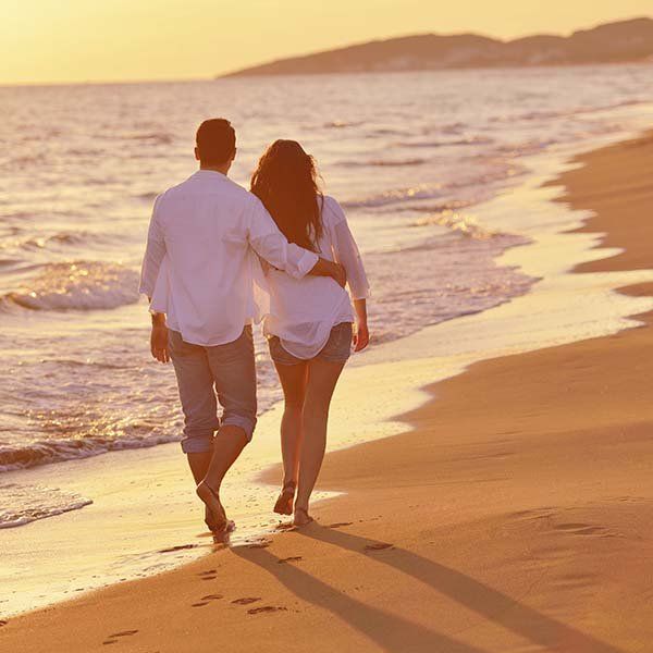couple walking at the beach