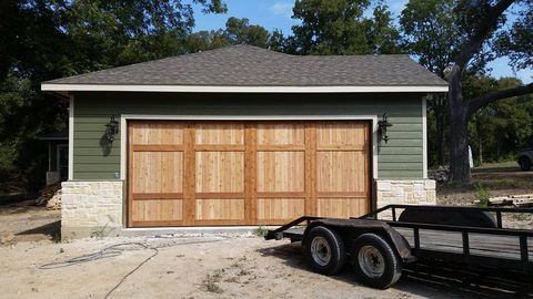 Residential Garage Door Repair - A Wooden Garage Door With A Truck In Front in Dallas/Fort Worth, TX Residential Garage Door Repair - A Wooden Garage Door With A Truck In Front in Dallas/Fort Worth, TX