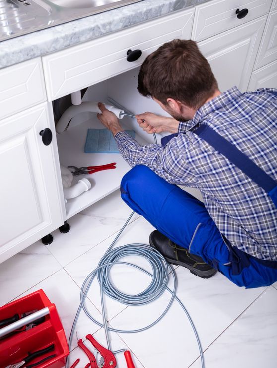 Plumber Cleaning Clogged Sink Pipe — San Diego, CA — Drain Patrol