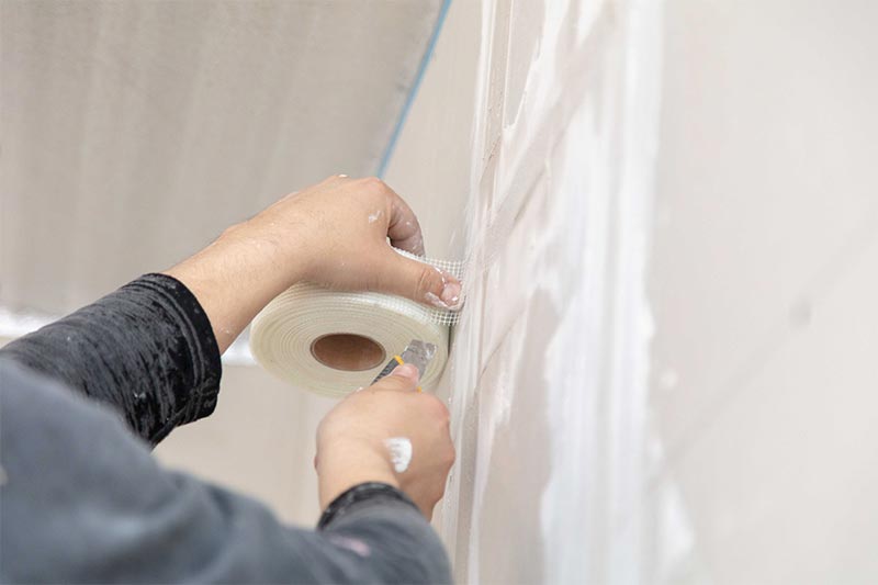Application Of Mesh Tape On Plasterboard Wall
