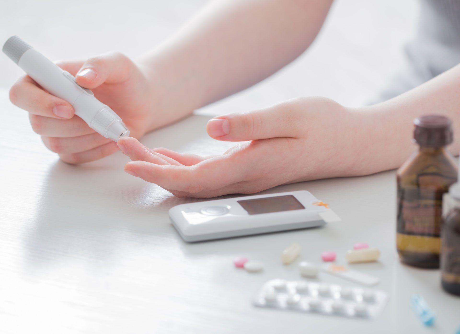 Woman Measures Blood Sugar Level — San Anselmo, CA — Jack's Medical Supplies