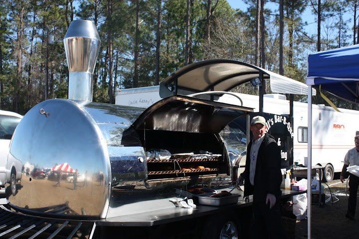 Man Grilling at the Train Cooker — Gainesville, FL — Hill’s Bar-b-que & Catering