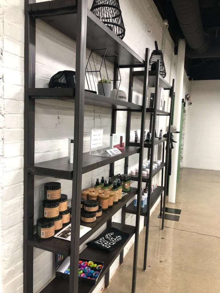A row of shelves filled with various items in a store.