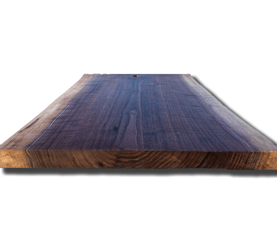 A piece of wood is sitting on a white surface
