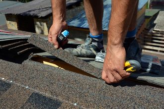 Man Repairing Roof — Salinas, CA — Urrutia Roofing Man Repairing Roof — Salinas, CA — Urrutia Roofing