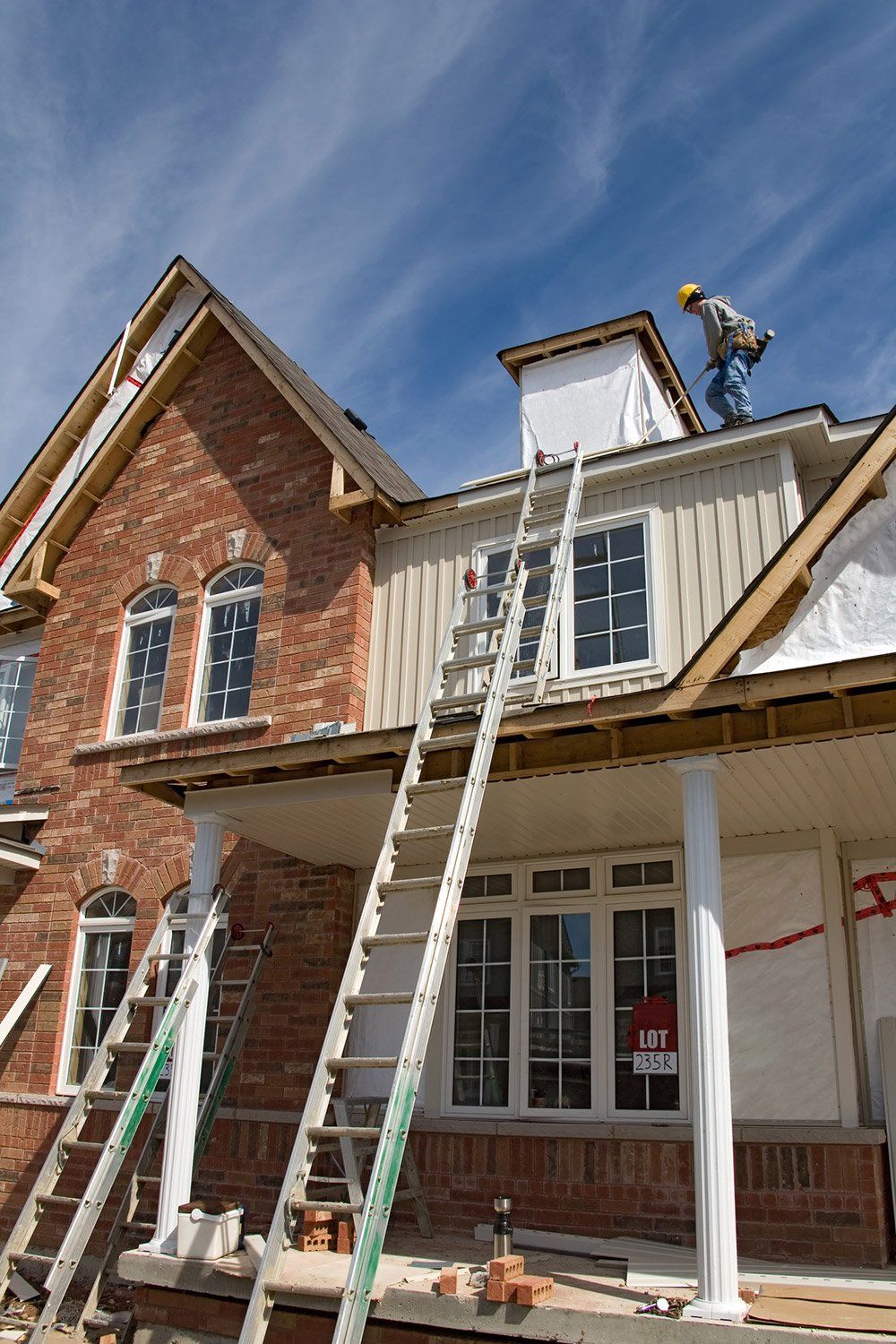 Workers Working in a House Roof — Salinas, CA — Urrutia Roofing Workers Working in a House Roof — Salinas, CA — Urrutia Roofing