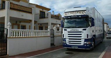A large truck entering a cargo ship for European removals