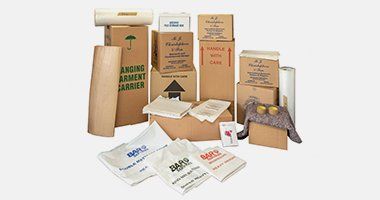 Cardboard boxes packed with household items and ready for shipping