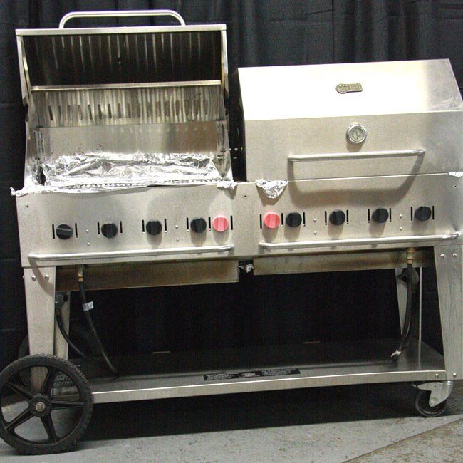 Stainless steel barbecue grill on wheels with open firebox and control knobs
