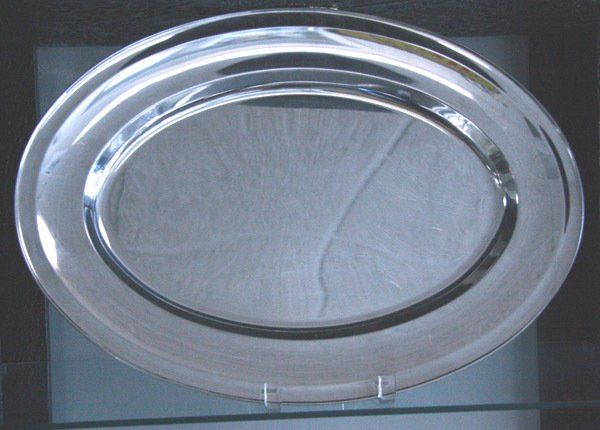 Clear plastic plate with a gray paper liner on a light background