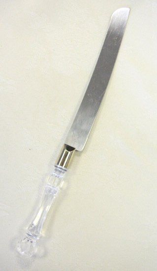 Clear-handled butter knife on a light background.