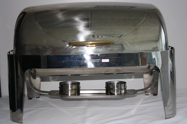 Stainless steel food warmer with a clear cover and two round containers underneath
