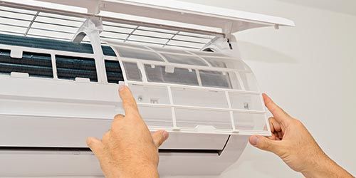Checking Air Conditioner — Residential Clients in Corona, CA Checking Air Conditioner — Residential Clients in Corona, CA