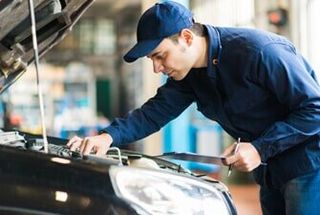 Mechanic at work—Auto Inspection in East Windsor, CT Mechanic at work—Auto Inspection in East Windsor, CT