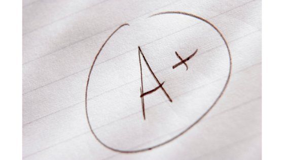 A+ is written in a circle on a piece of paper