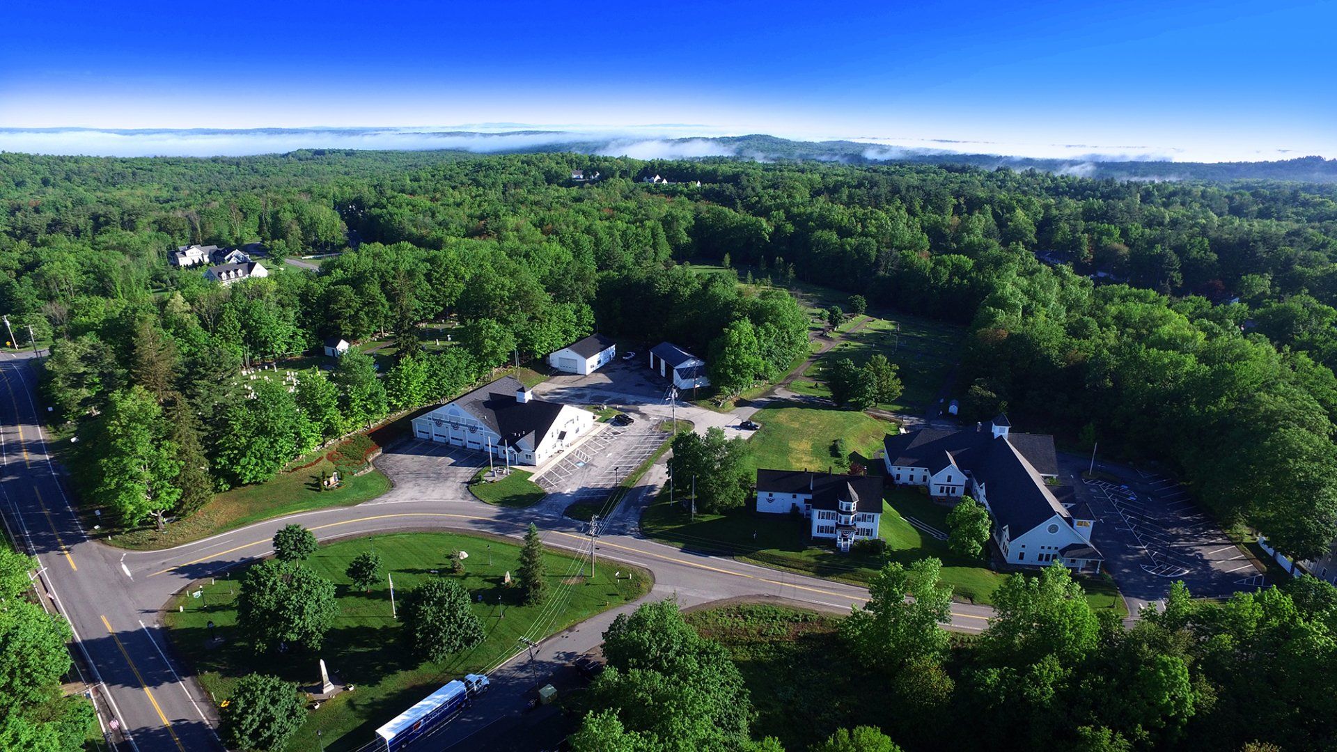 An aerial view of a residential area surrounded by trees