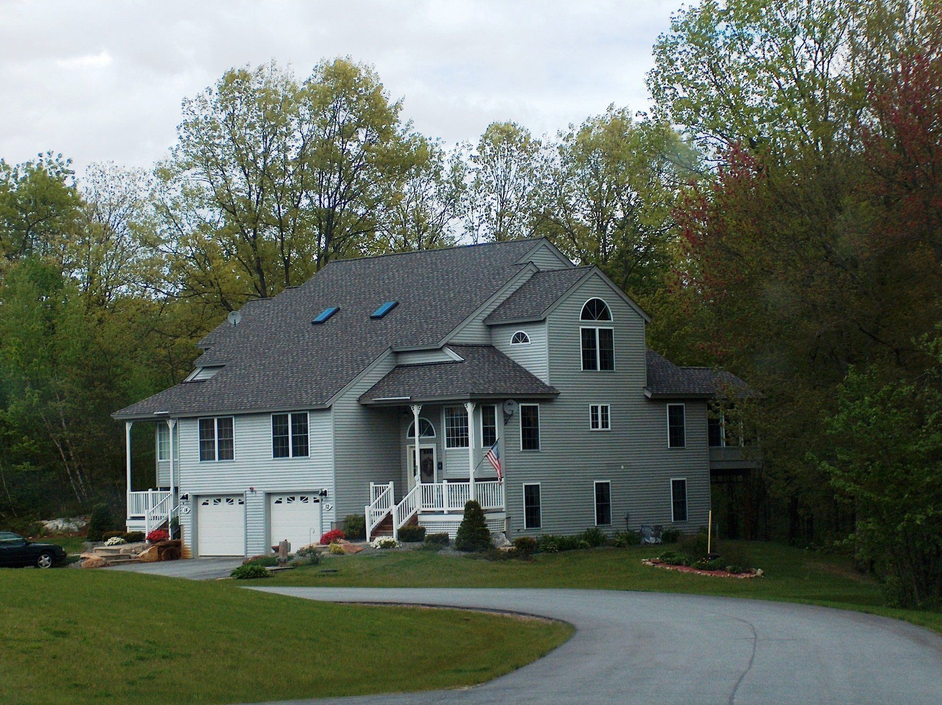 A large house with a driveway leading to it