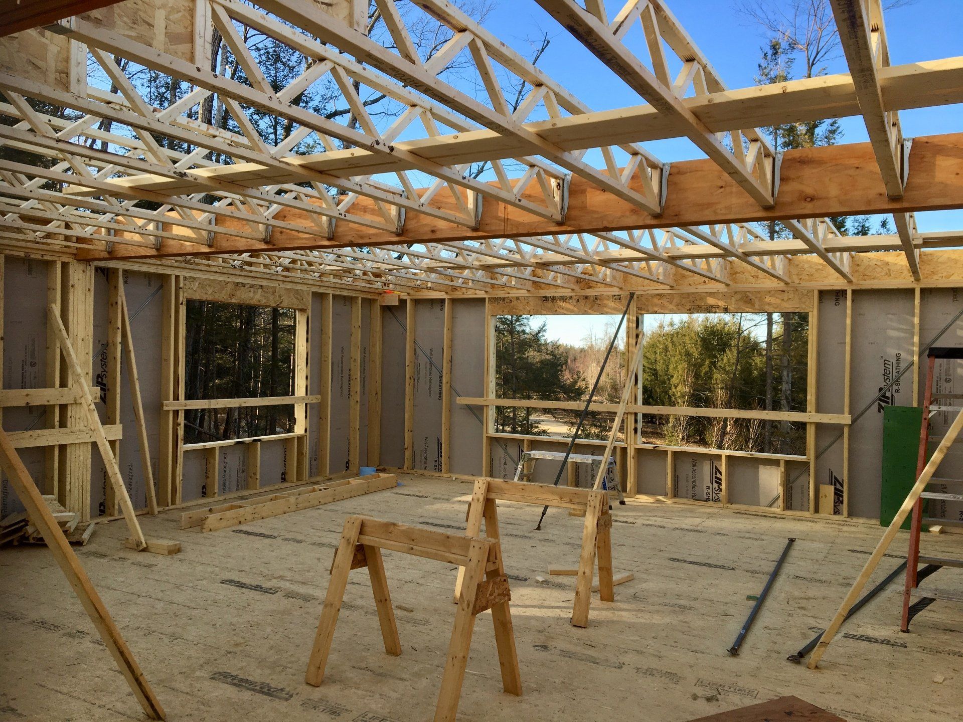 A house is being built with a lot of wooden beams.