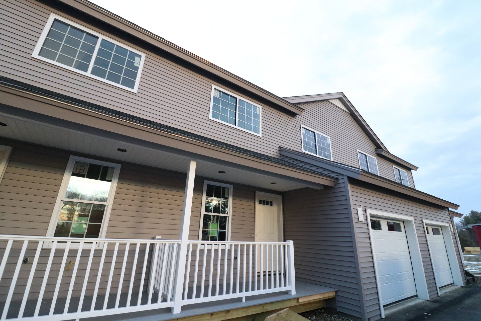 A house with a porch and a white railing