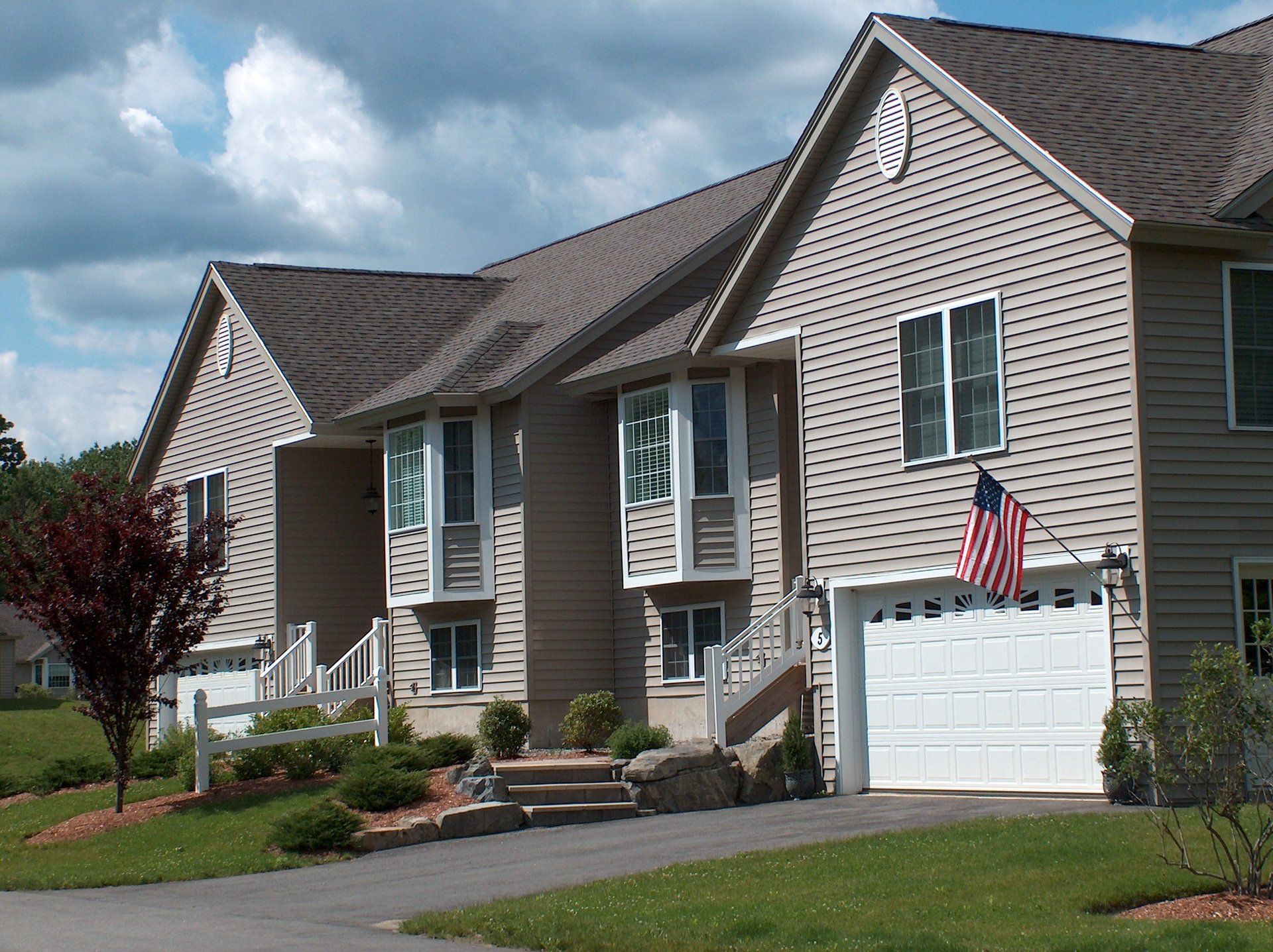 A house with an american flag in front of it