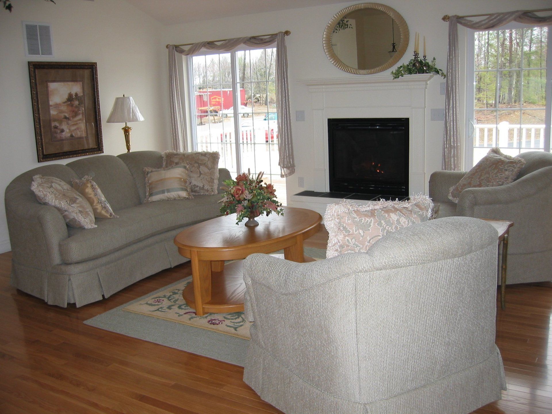 A living room filled with furniture and a fireplace