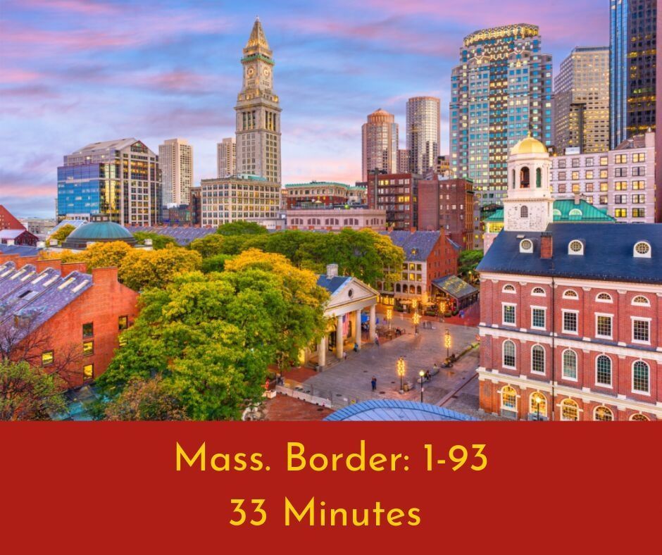 An aerial view of a city with the words mass border 1-93 33 minutes