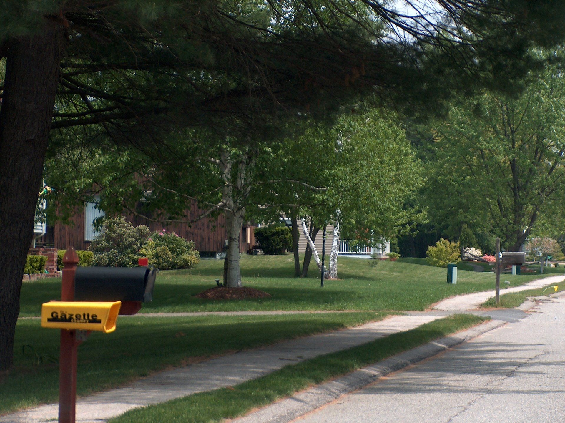 A mailbox on the side of a road that says james on it