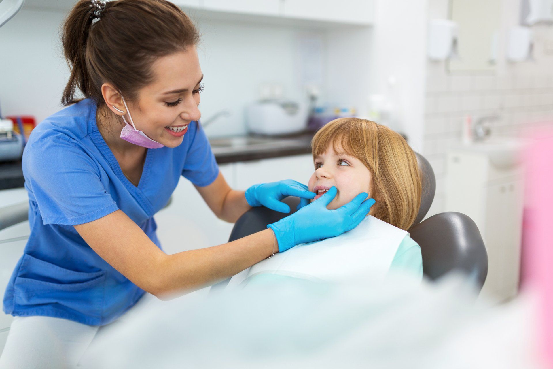 Female Dentist And Child In A Dentist Office - Dental Treatments in Port Macquarie, NSW Female Dentist And Child In A Dentist Office - Dental Treatments in Port Macquarie, NSW