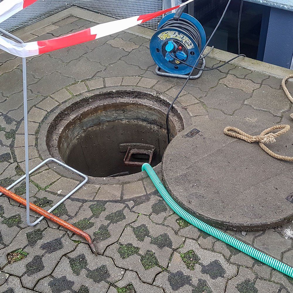 Working in a Manhole From Above — Roto-Rooter — Logan, UT