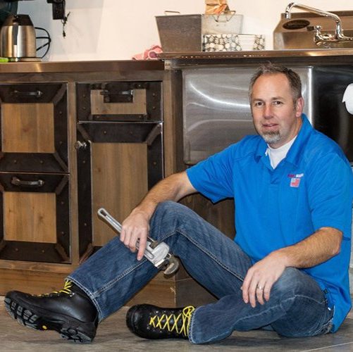 Man Fixing Pipe — Logan, UT — Roto-Rooter Man Fixing Pipe — Logan, UT — Roto-Rooter