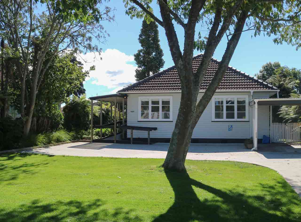 home with cut grass