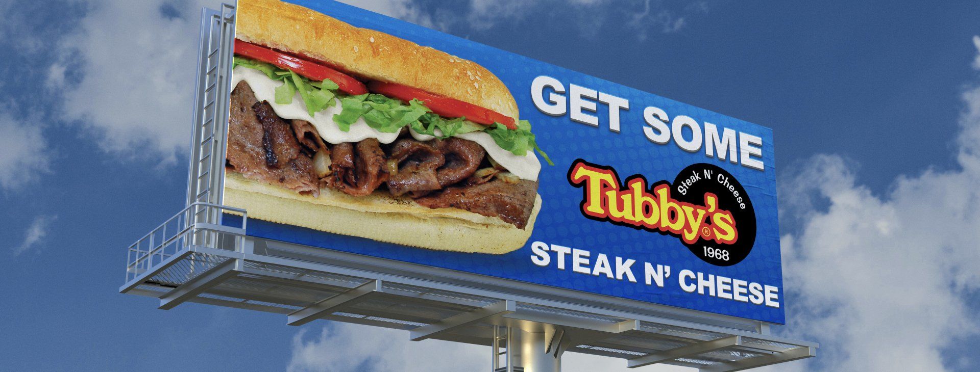A billboard that says get some tubby 's steak n cheese