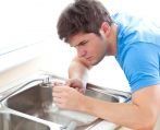 plumber fixing a tap