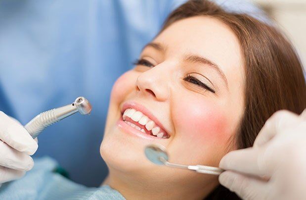 Lady Smiling During Dental Cleaning — Bristol, TN — McMillin & Christian Family Dentistry Lady Smiling During Dental Cleaning — Bristol, TN — McMillin & Christian Family Dentistry