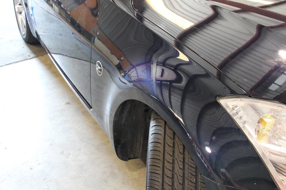 a close up of a car 's fender and tire