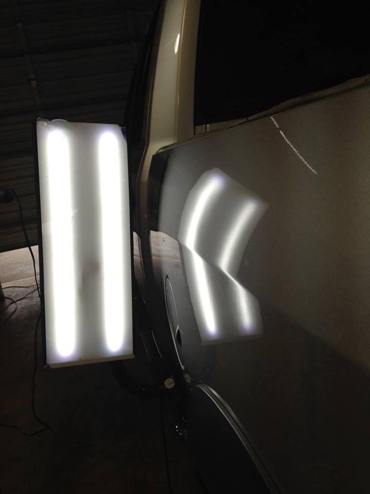 a car with a light on the side of it