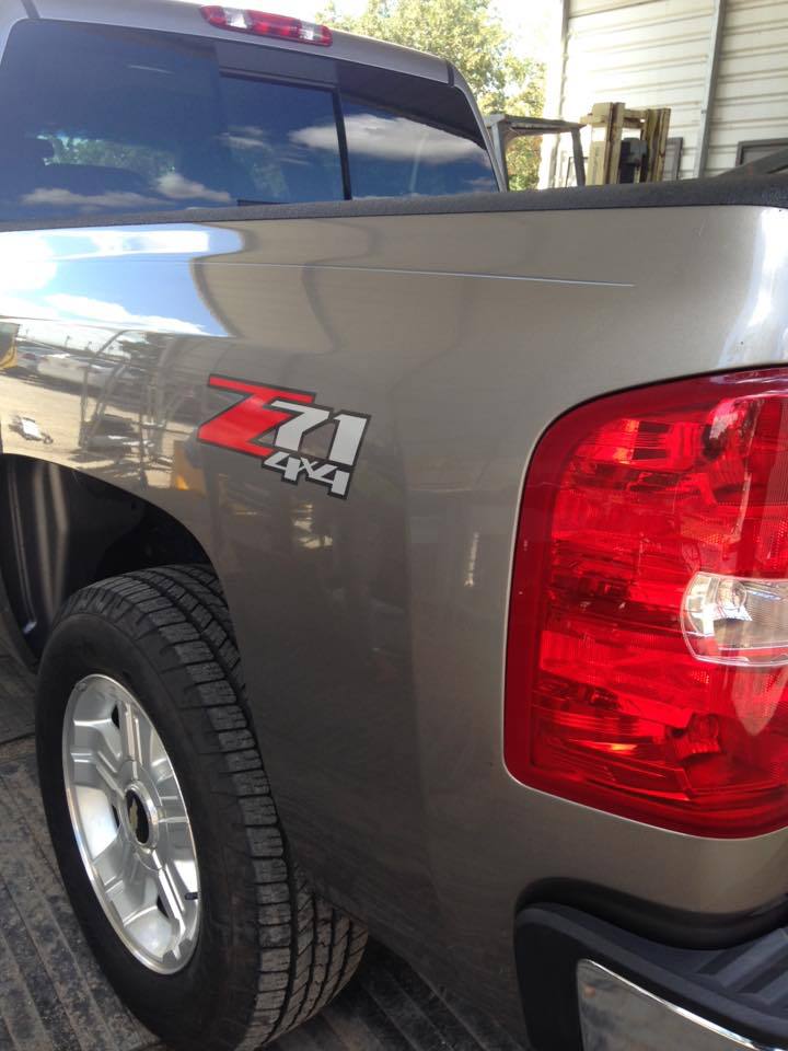 a silver truck with a z71 4x4 logo on the side